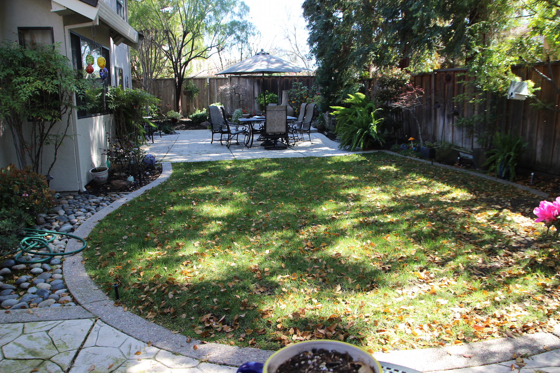 Before backyard with small patio | Outer Visions Landscape Design